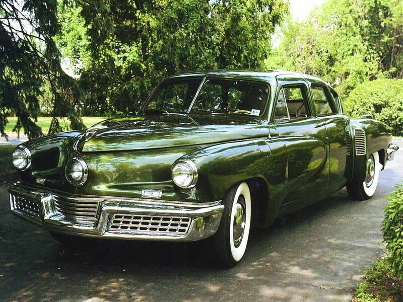 green vintage car parked outside