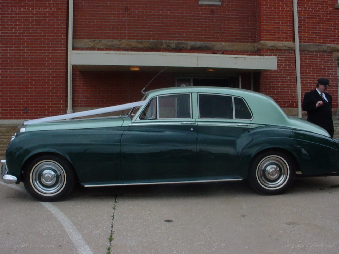 Green vintage car with ribbon