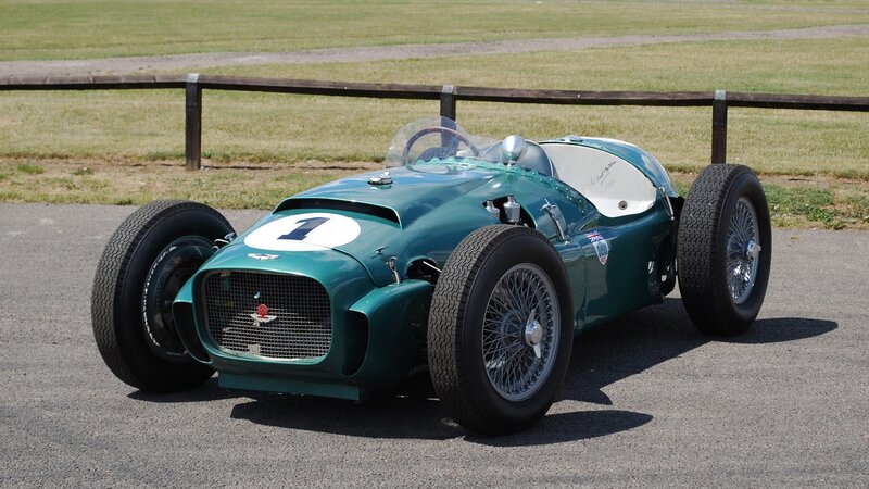 Green Vintage Race Car — Calm, Afternoon, Photograph, Grass