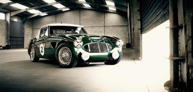 Green vintage race car in garage