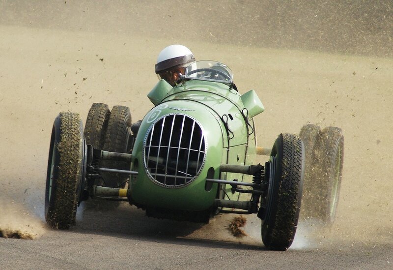 Green vintage race car on track
