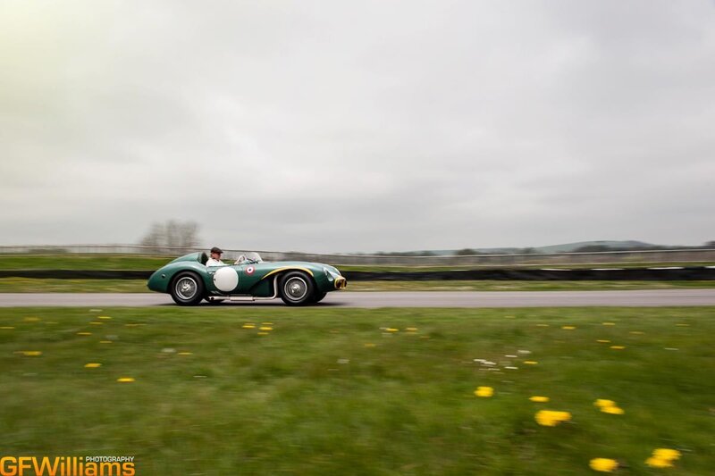 green vintage race car on track