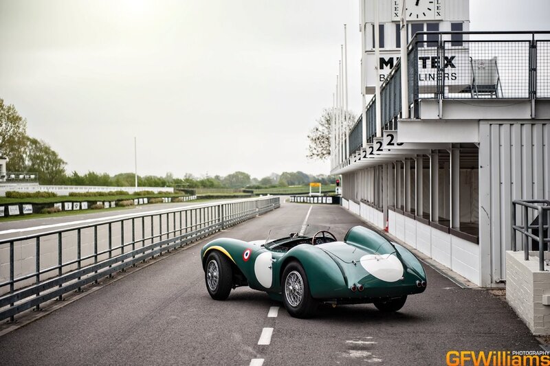 Green vintage race car on track