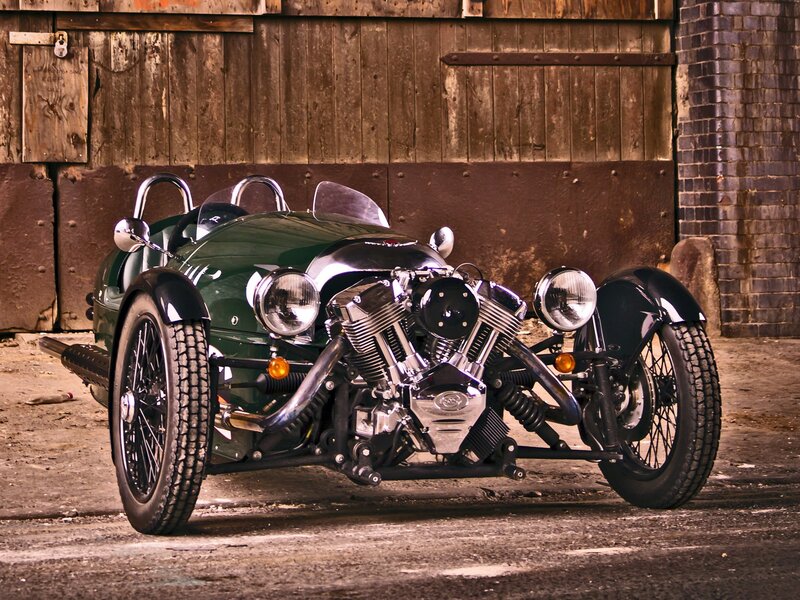 Green vintage three-wheeled car