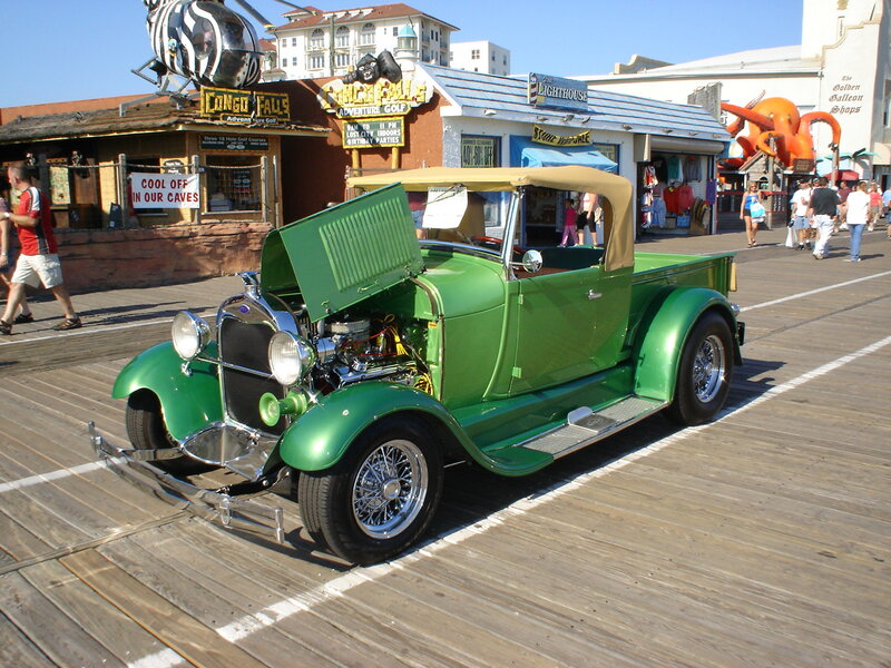 Green vintage truck on boardwalk