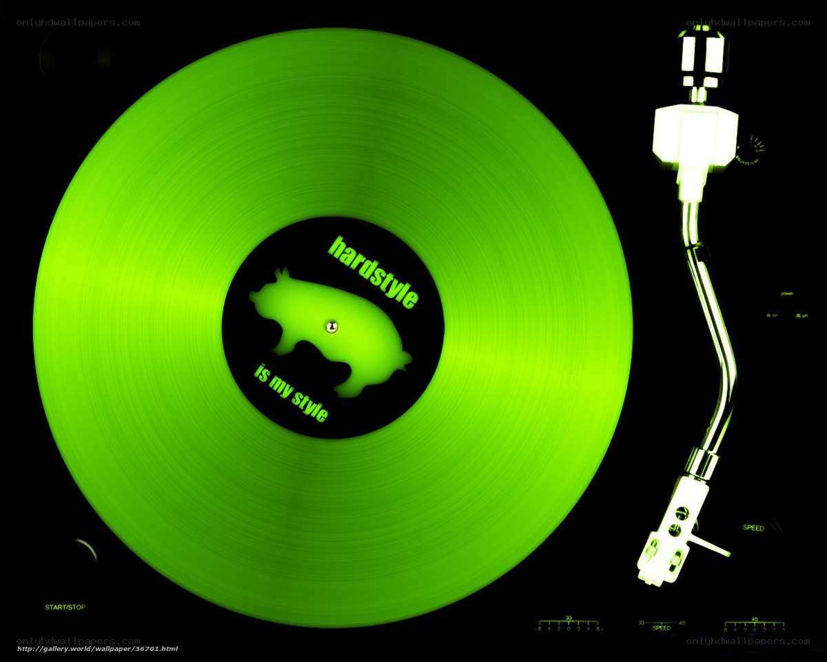 green vinyl record on turntable
