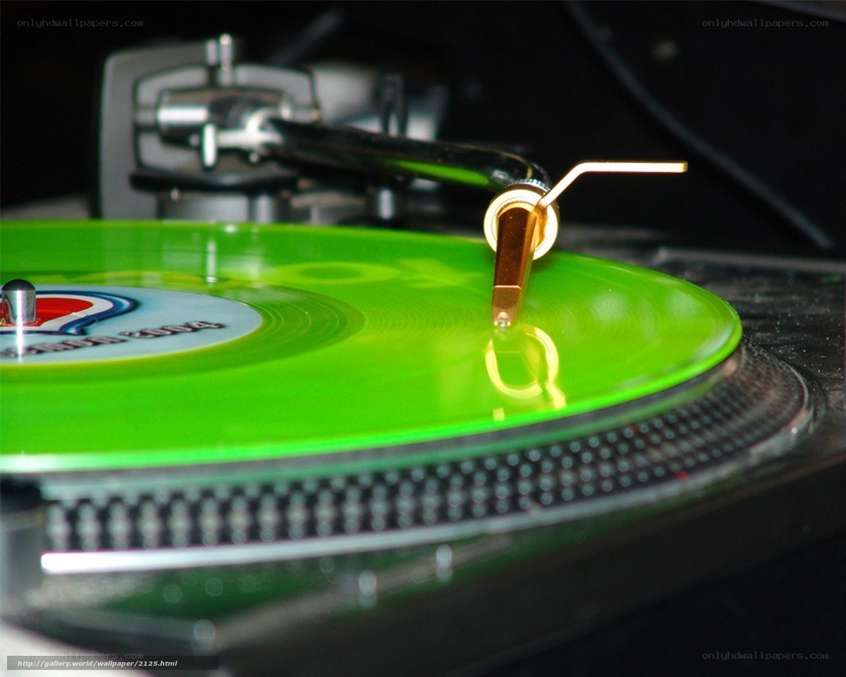 green vinyl record on turntable