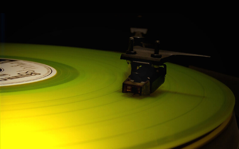 green vinyl record playing