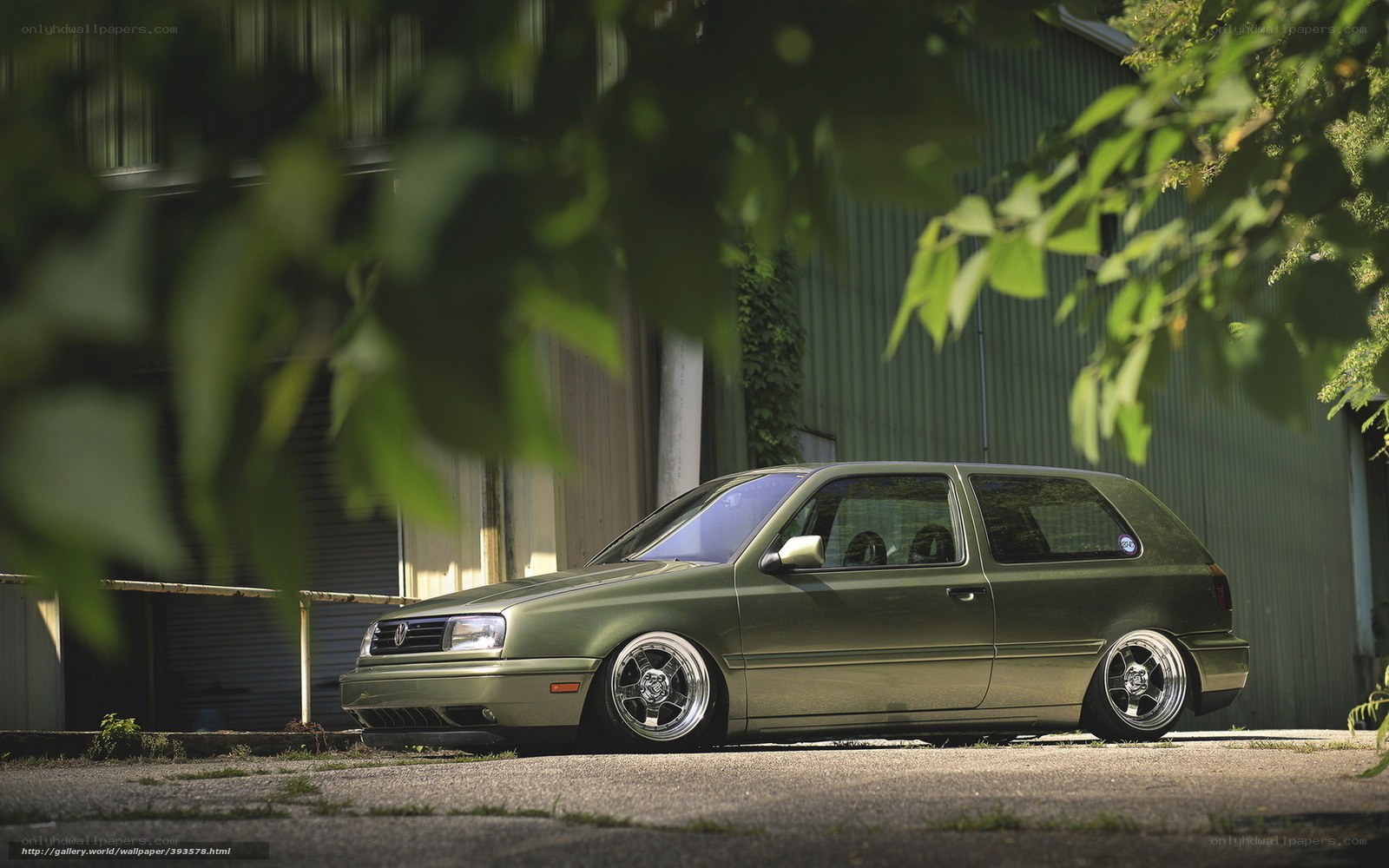 Green Volkswagen Golf parked outside