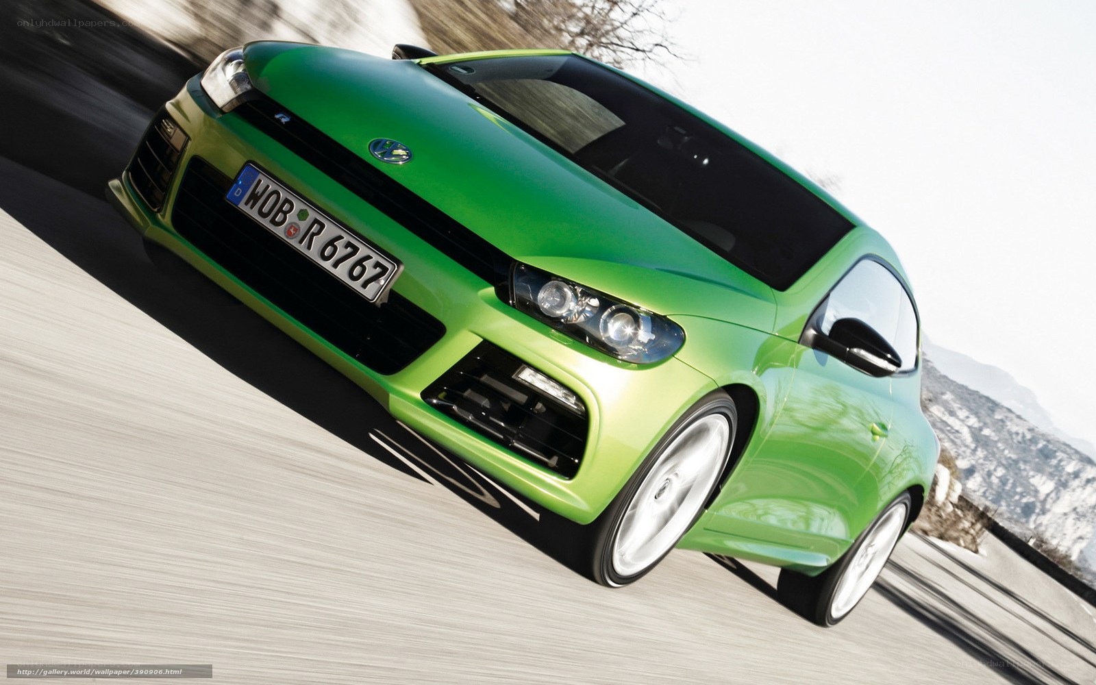 green volkswagen scirocco in motion
