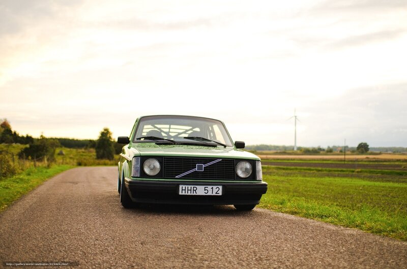 Green Volvo on a country road