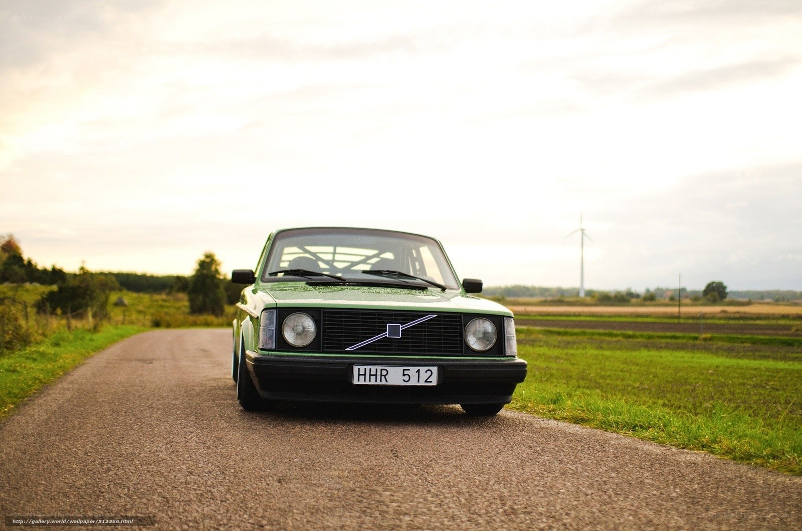 Green Volvo on a country road