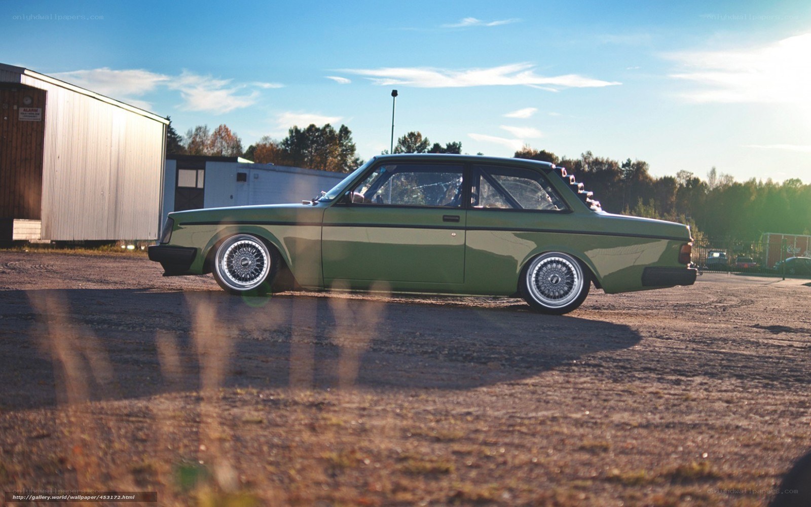 green volvo with custom wheels