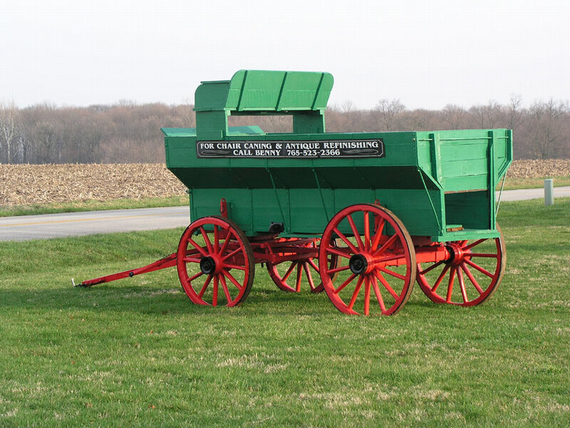 green wagon with red wheels