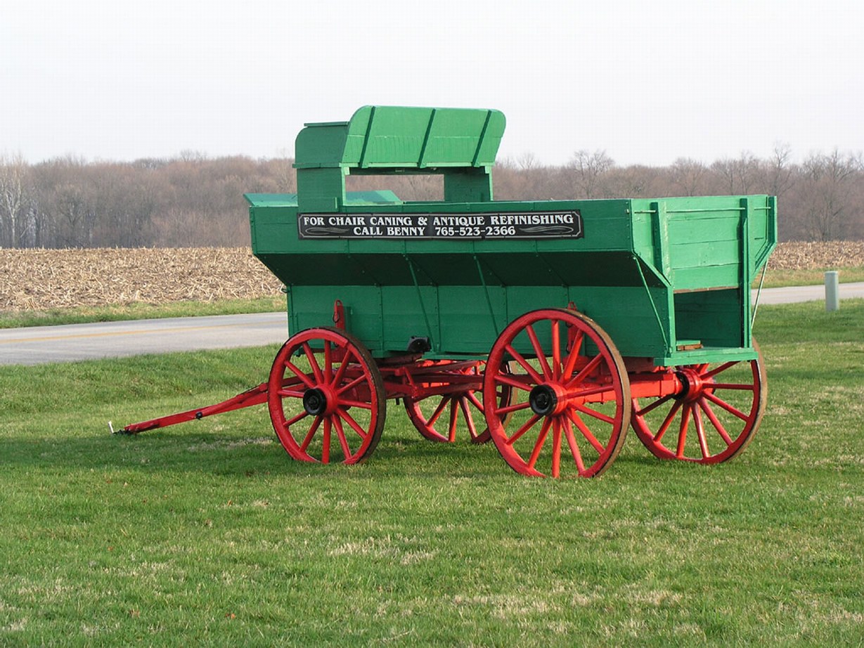 green wagon with red wheels