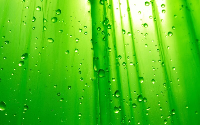 green water droplets on surface