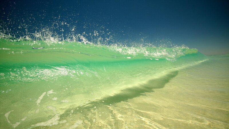 green wave at the beach