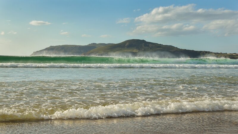 Green Wave Crashing on Beach — Blue