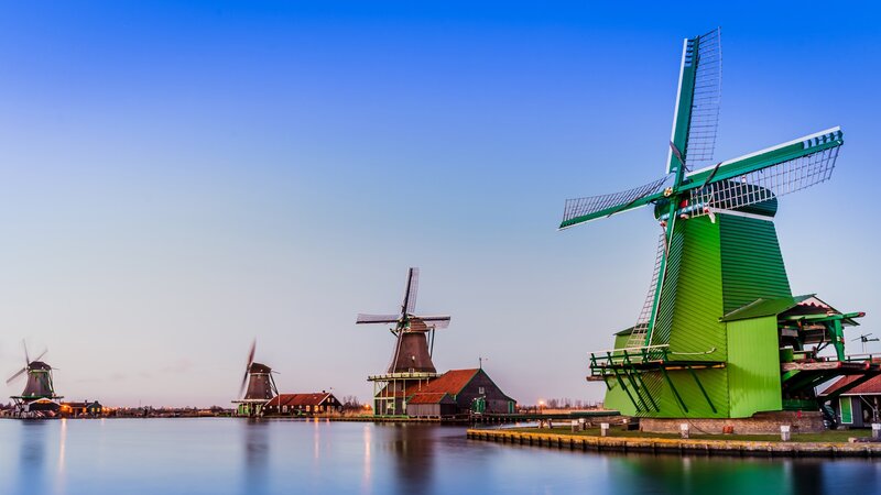 Green Windmills by Water