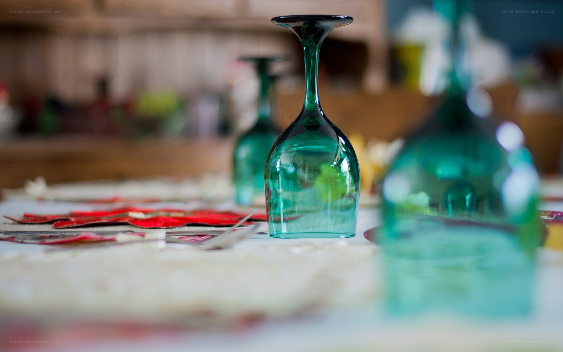 Green wine glasses on a table