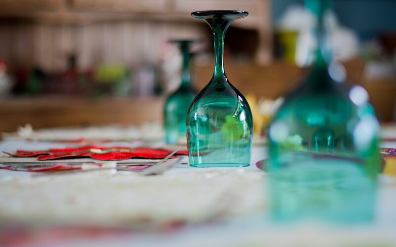 Green wine glasses on table
