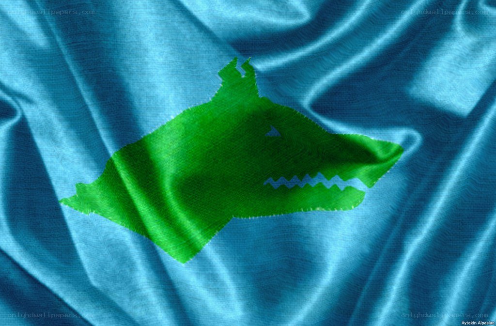 Green wolf on blue fabric