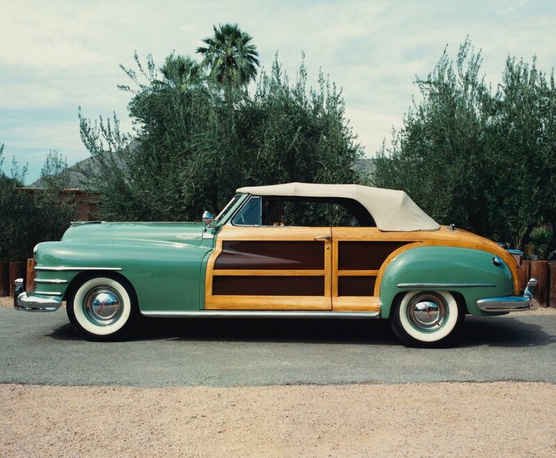 Green wood-paneled convertible car
