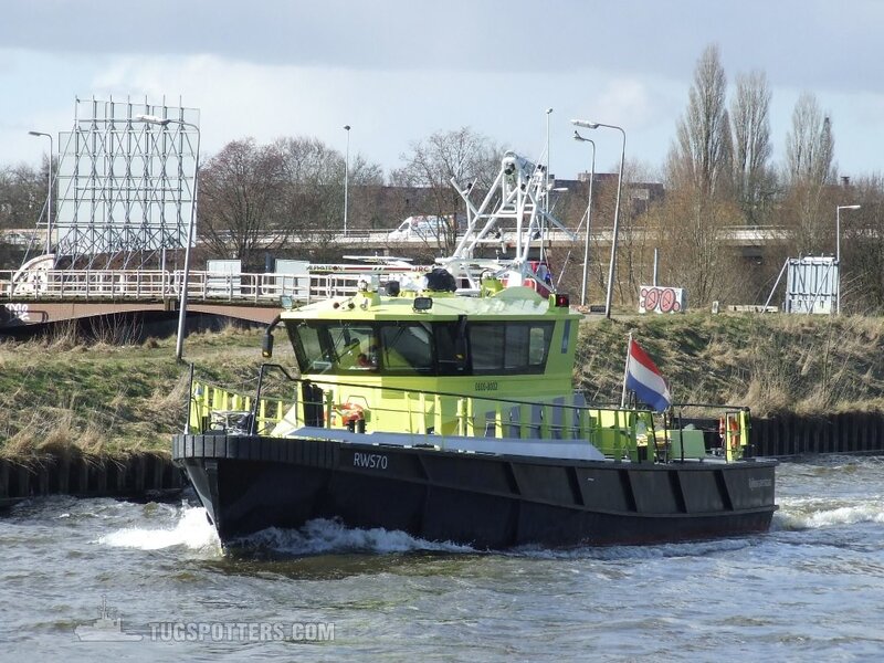 Green Workboat on River