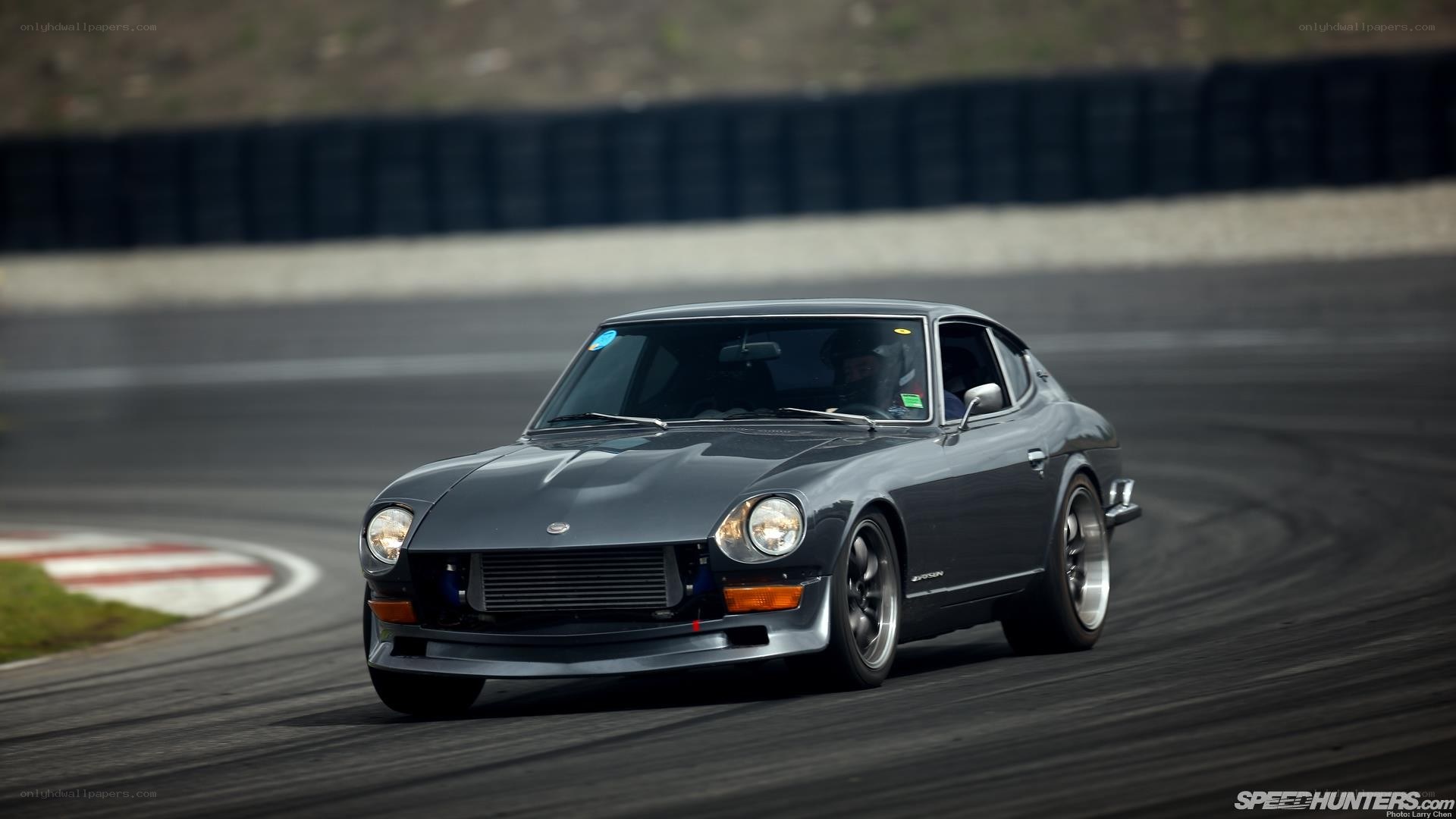 Grey Datsun on a racetrack