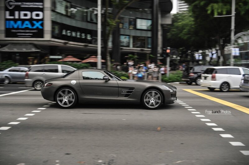 Grey sports car on city street