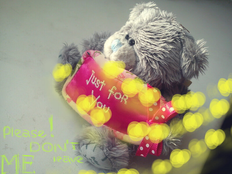 Grey Teddy Bear Holding Gift