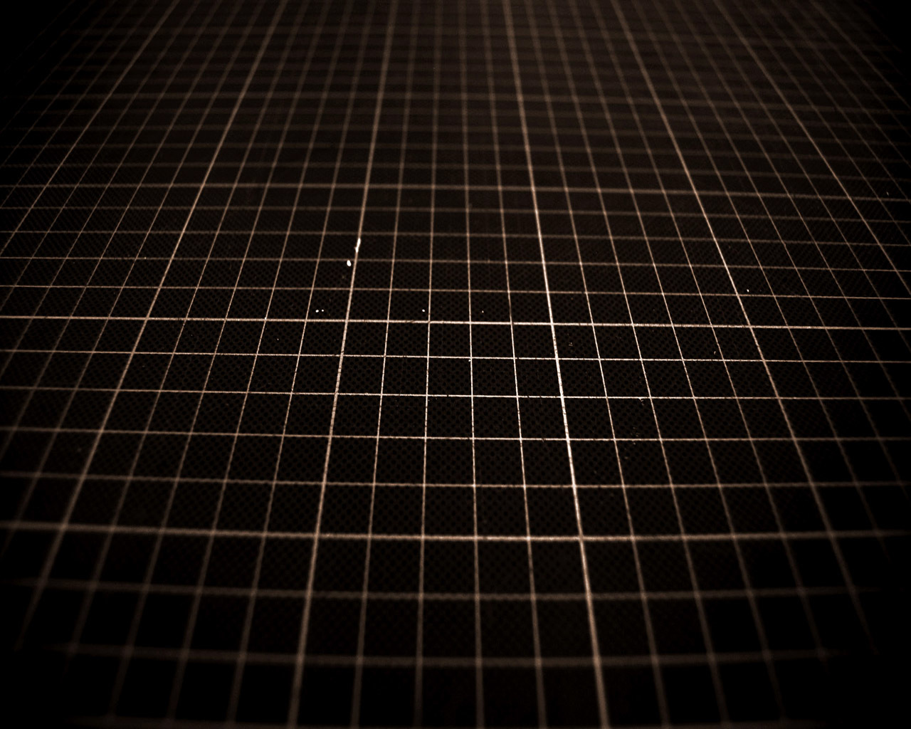 grid pattern on dark surface