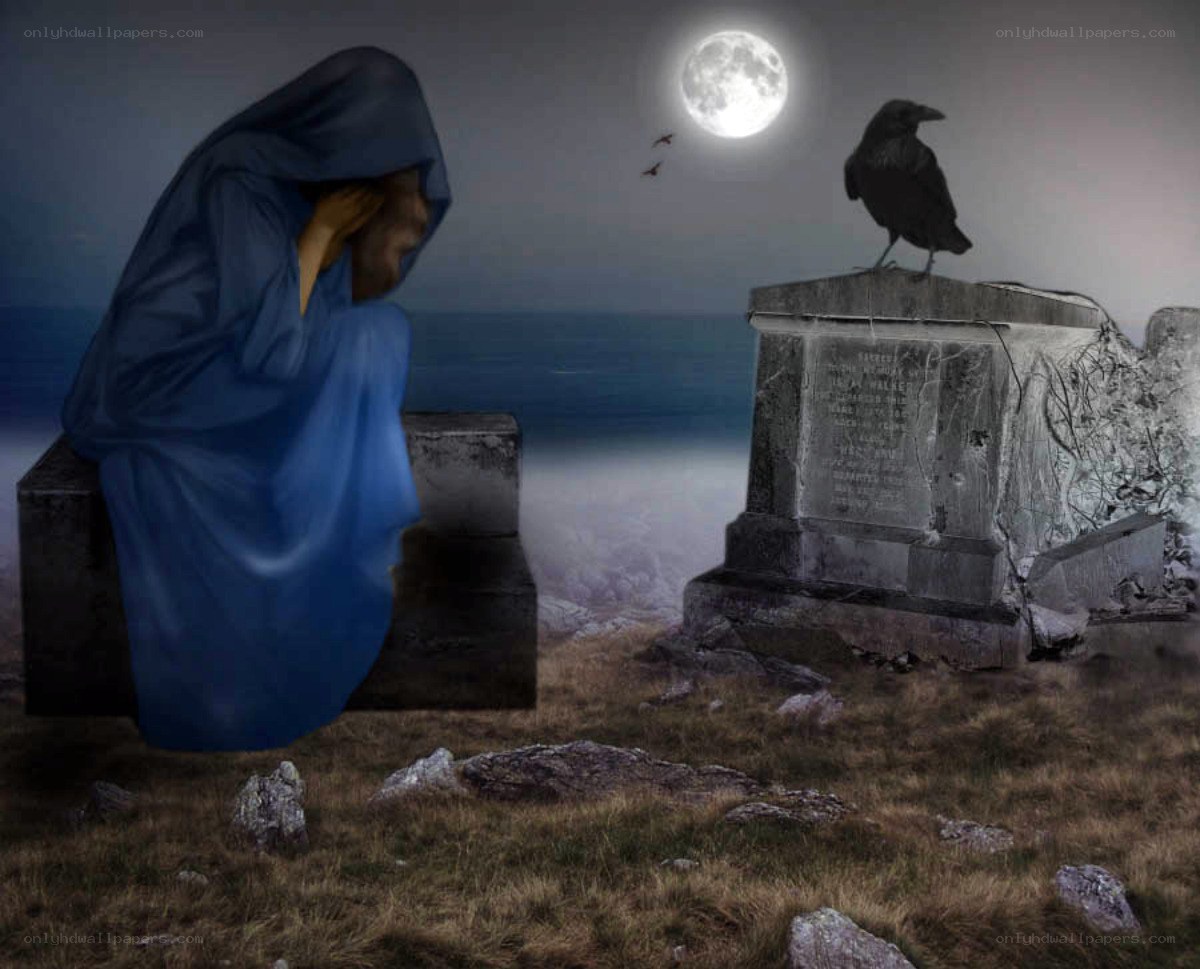 Grieving figure at a gravesite