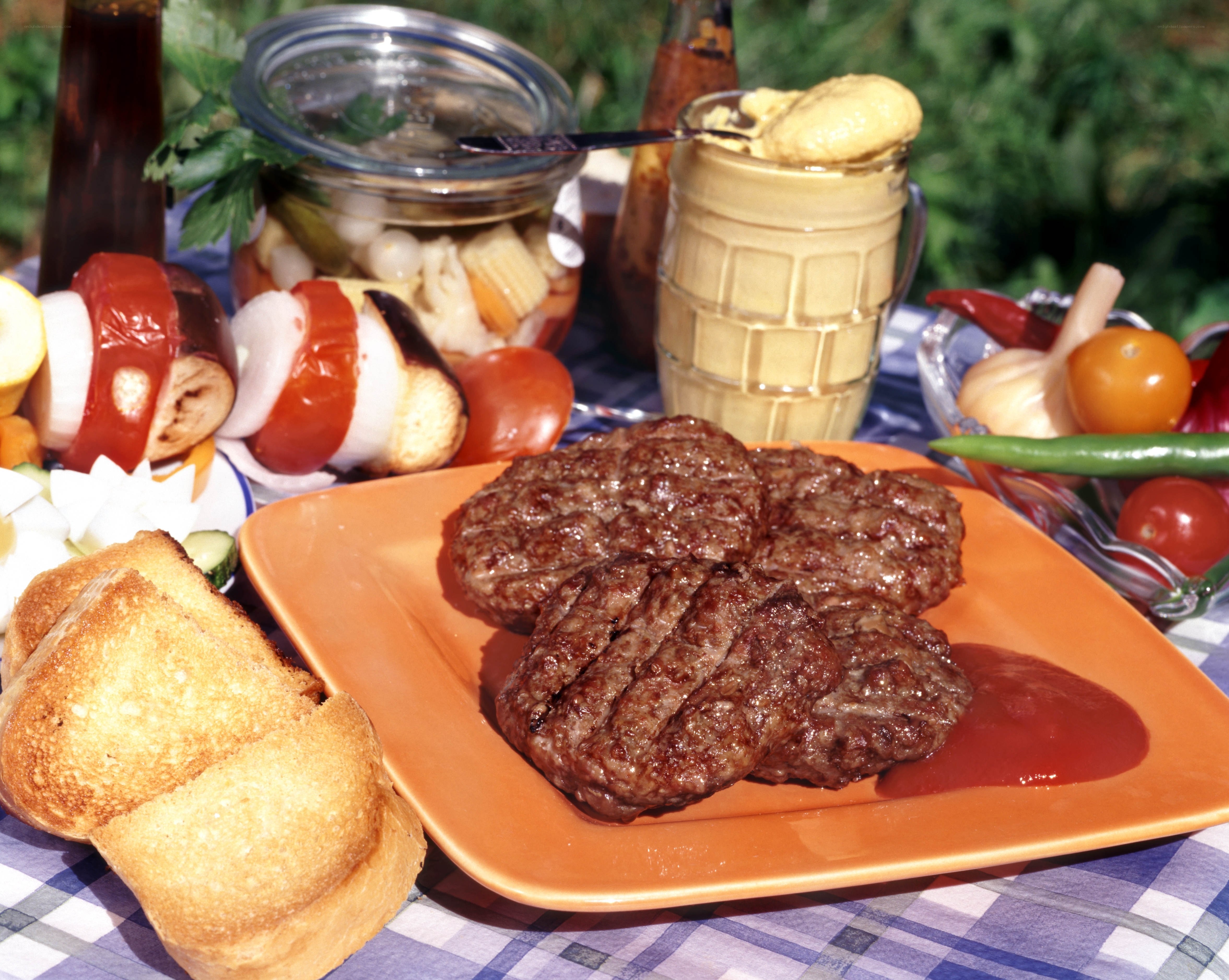 Grilled burgers and picnic spread
