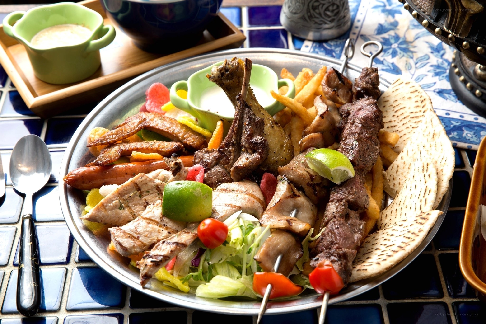 Grilled meat platter with sides
