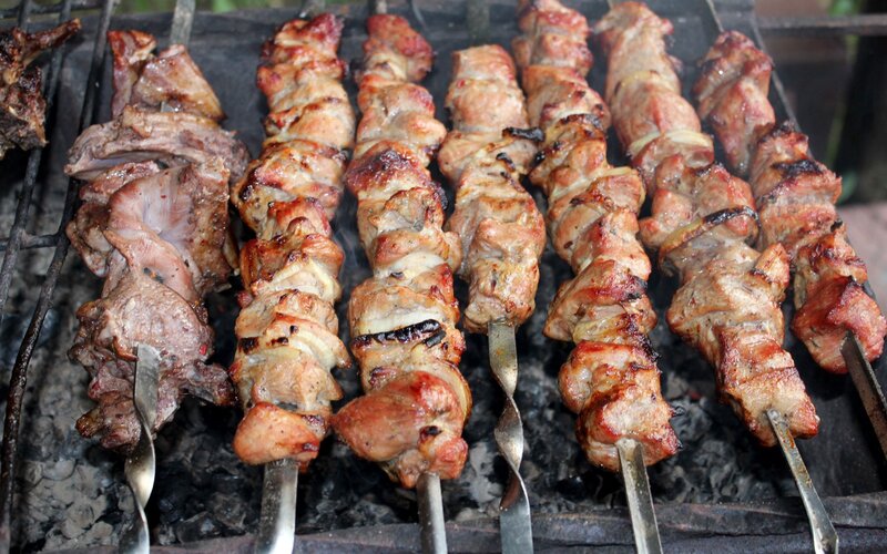 Grilled meat skewers on a barbecue