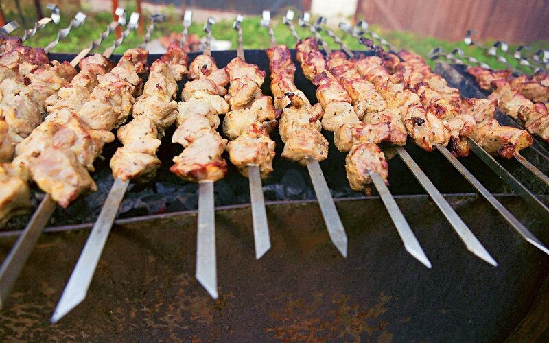 Grilled meat skewers on a barbecue