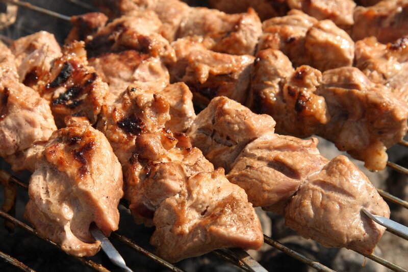 Grilled meat skewers on grill