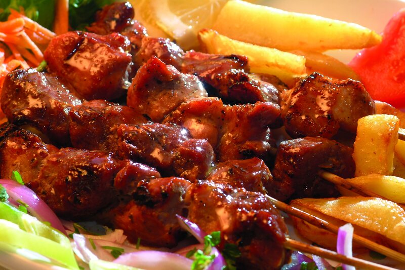 Grilled meat skewers with fries