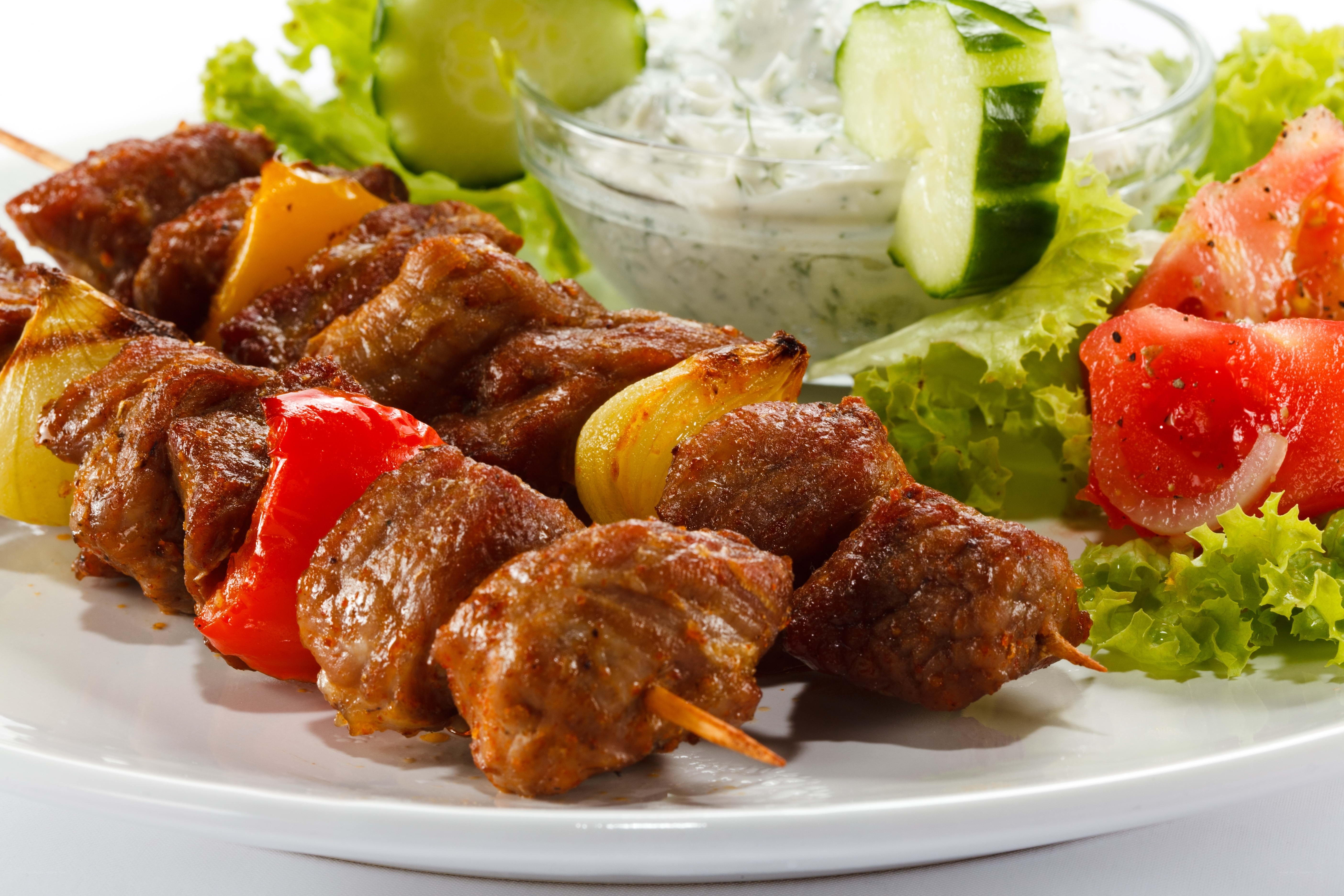 grilled meat skewers with salad
