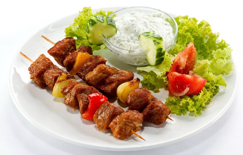 Grilled meat skewers with tzatziki