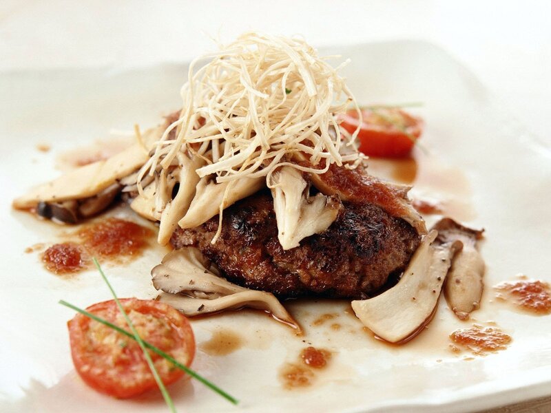Grilled meat with mushrooms and garnish