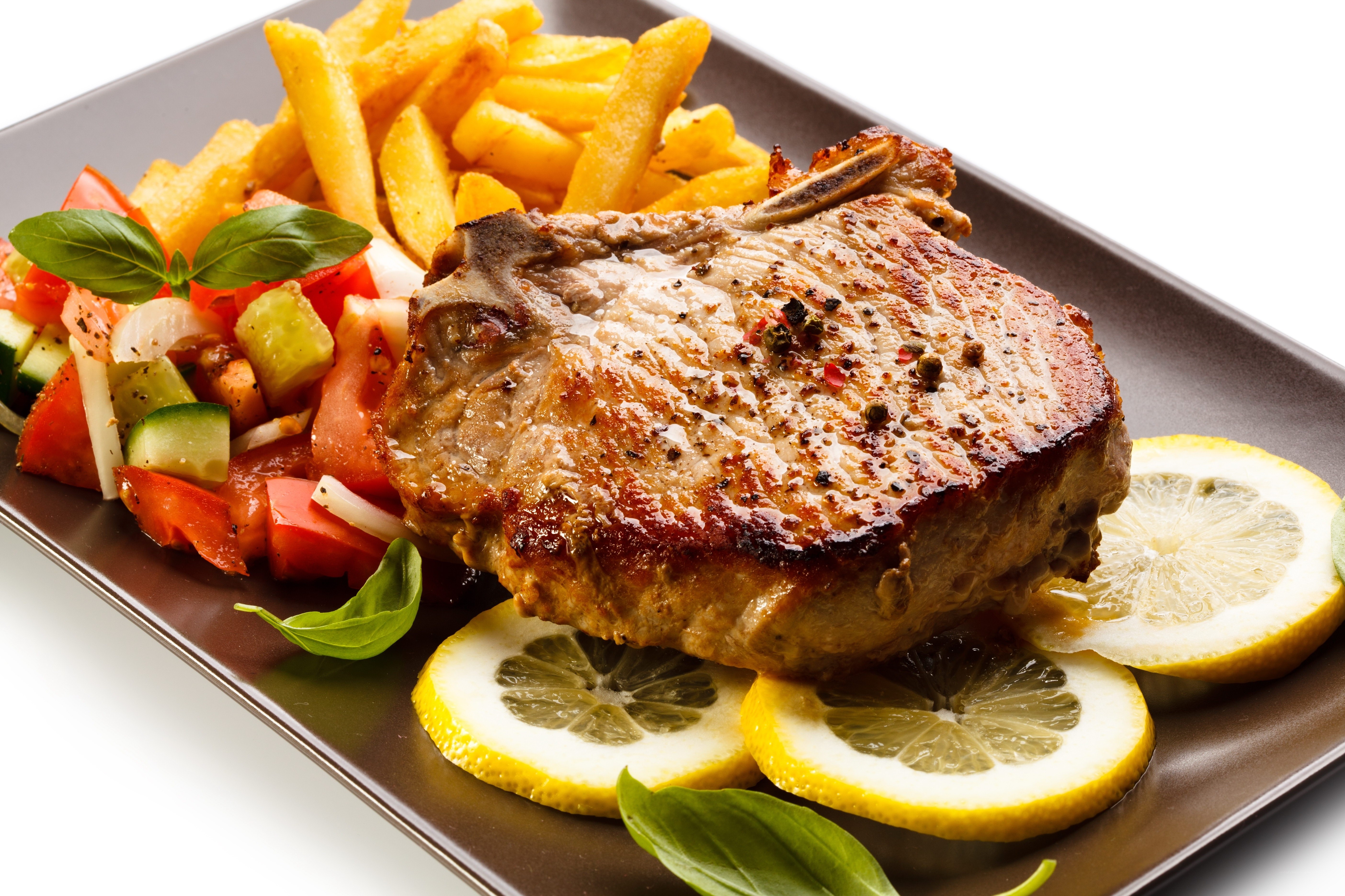 Grilled pork chop with fries