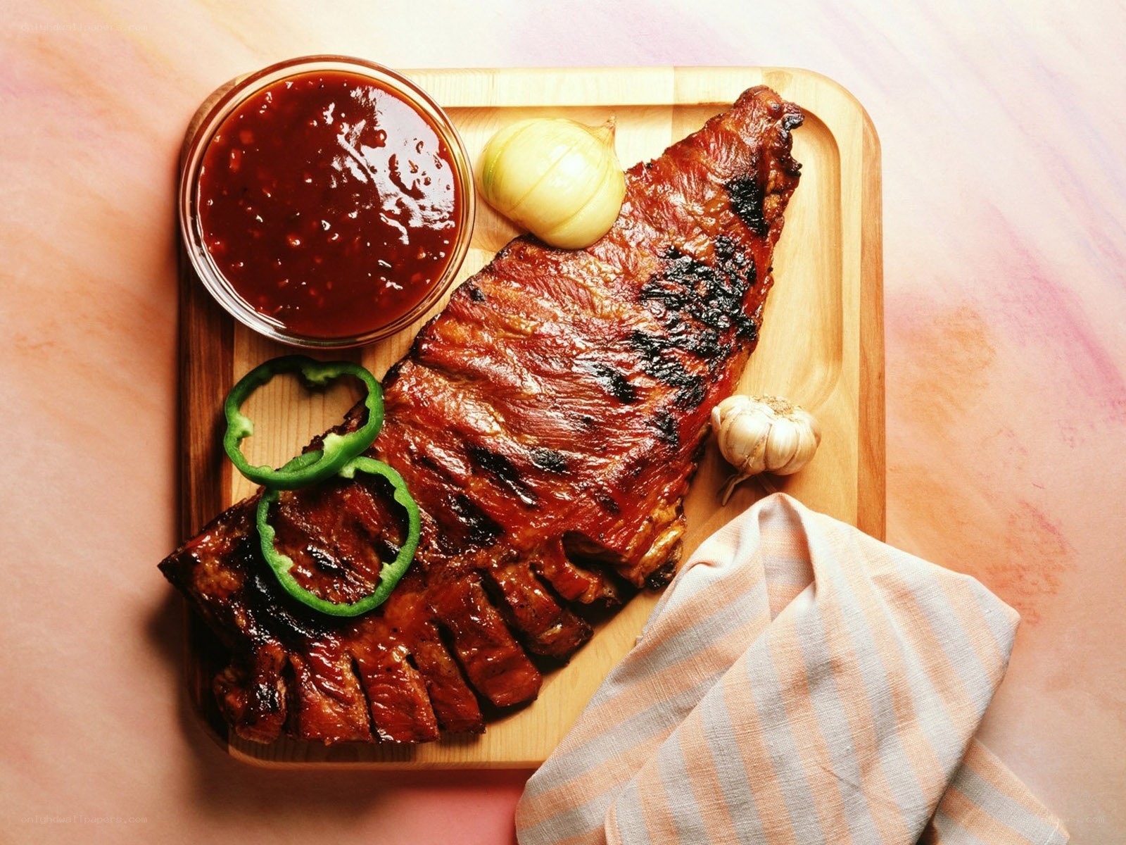 Grilled ribs with sauce and garnish