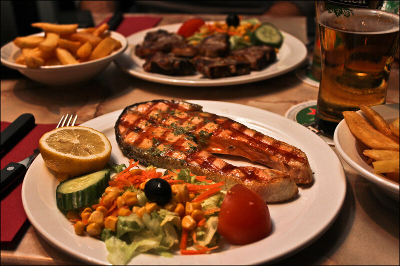Grilled salmon with fries and salad