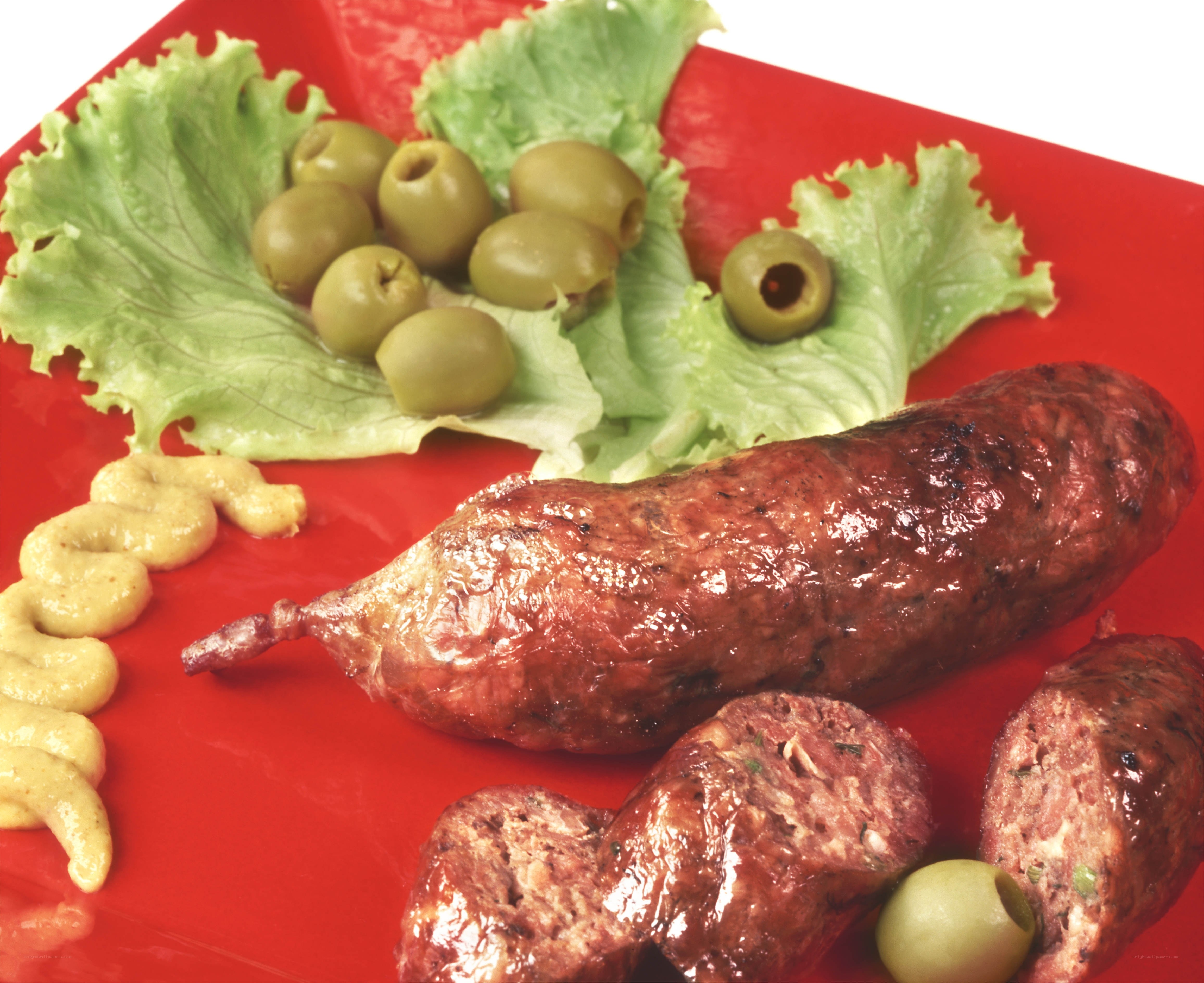 Grilled sausage with olives and mustard