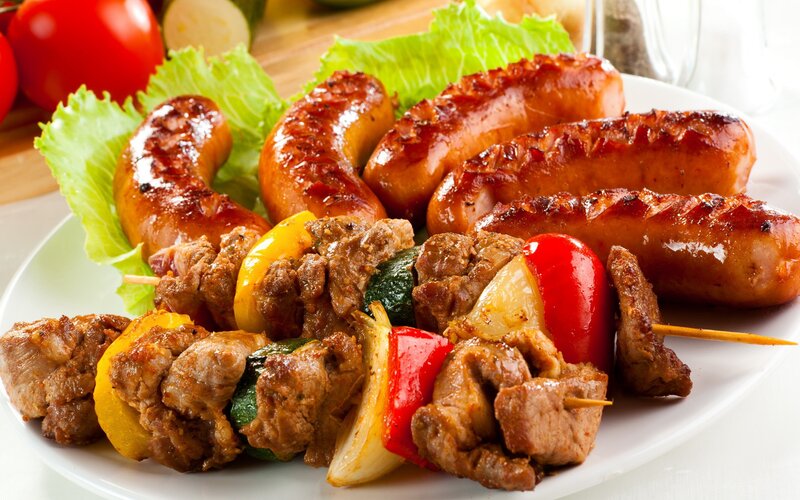 Grilled sausages and meat skewers