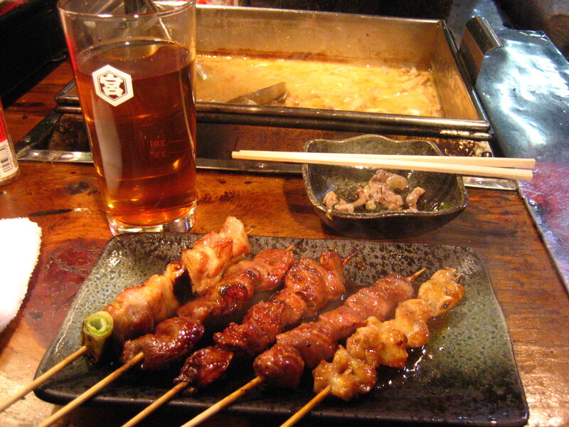 Grilled skewers and beer at a Japanese restaurant