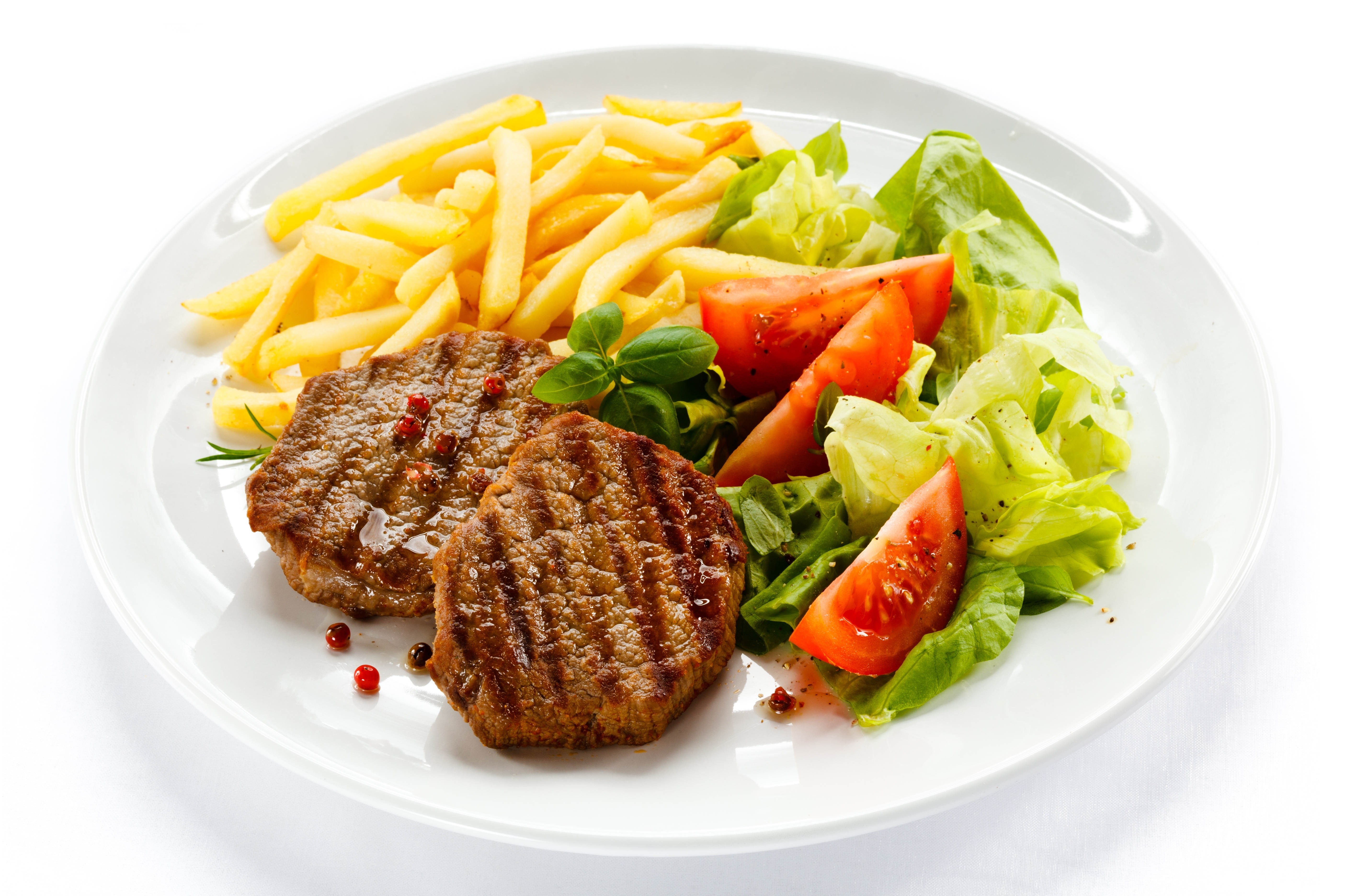 Grilled steak with fries and salad