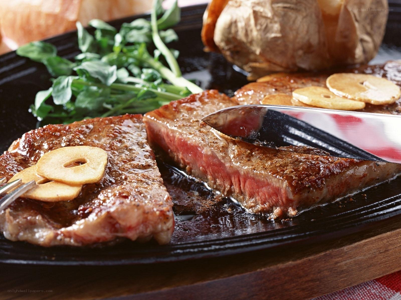 Grilled steak with garlic and greens